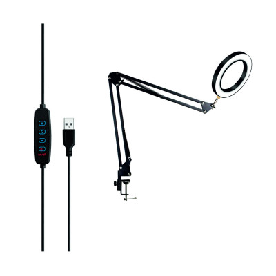 Настольная лампа в виде светодиодного светильника диаметром 15 см на пантографе со струбциной